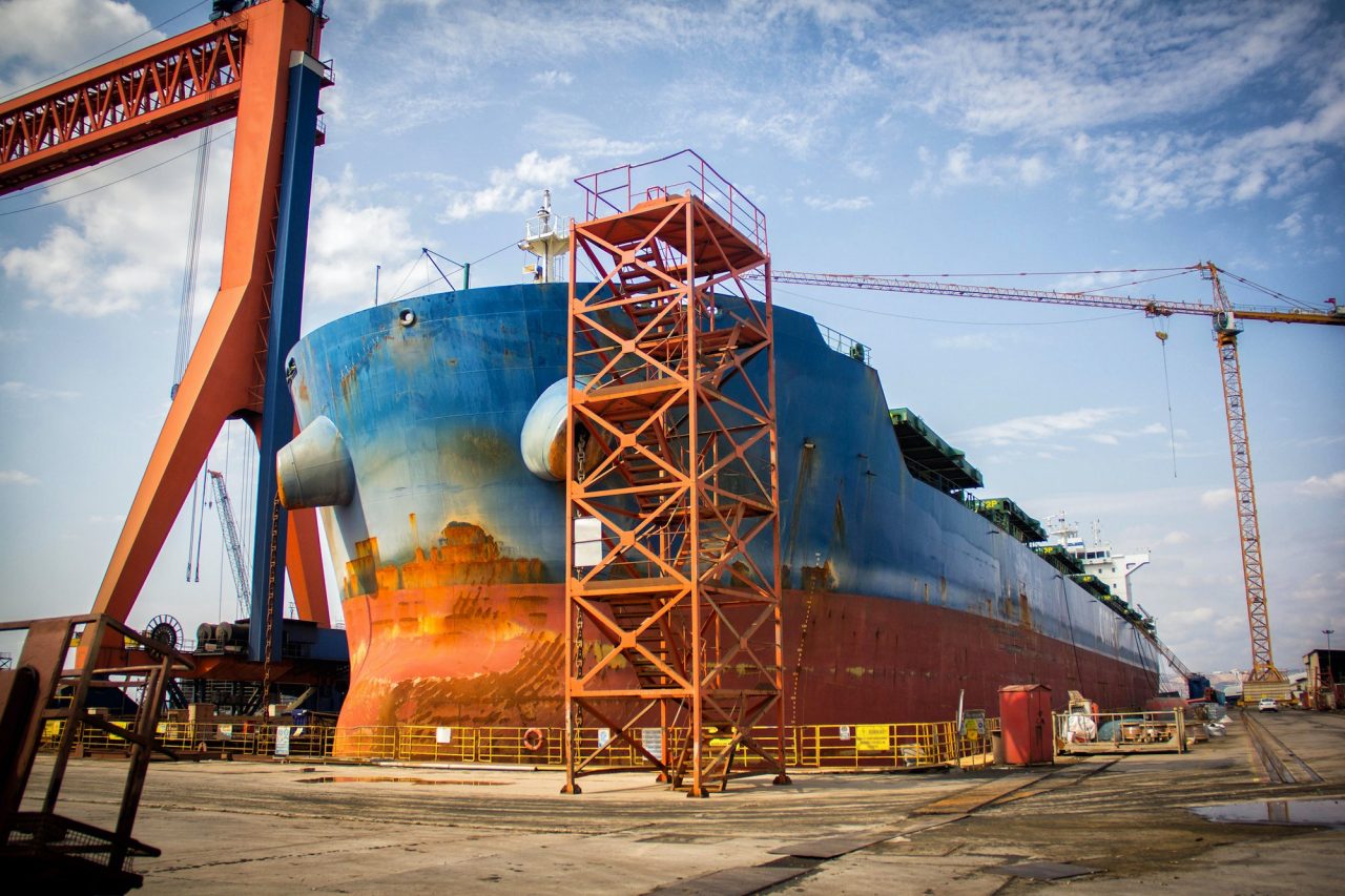 a-large-tanker-cargo-ship-is-being-renovated-and-painted-in-shipyard-dry-dock.jpg